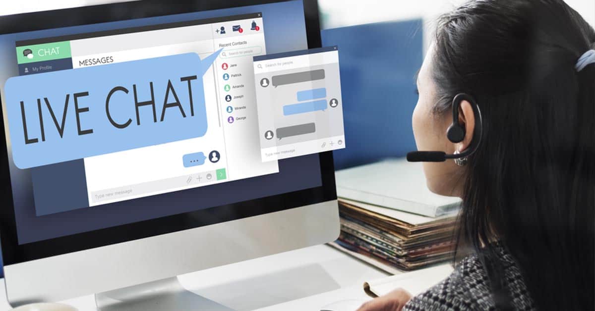 Person with headset using live chat for customer support