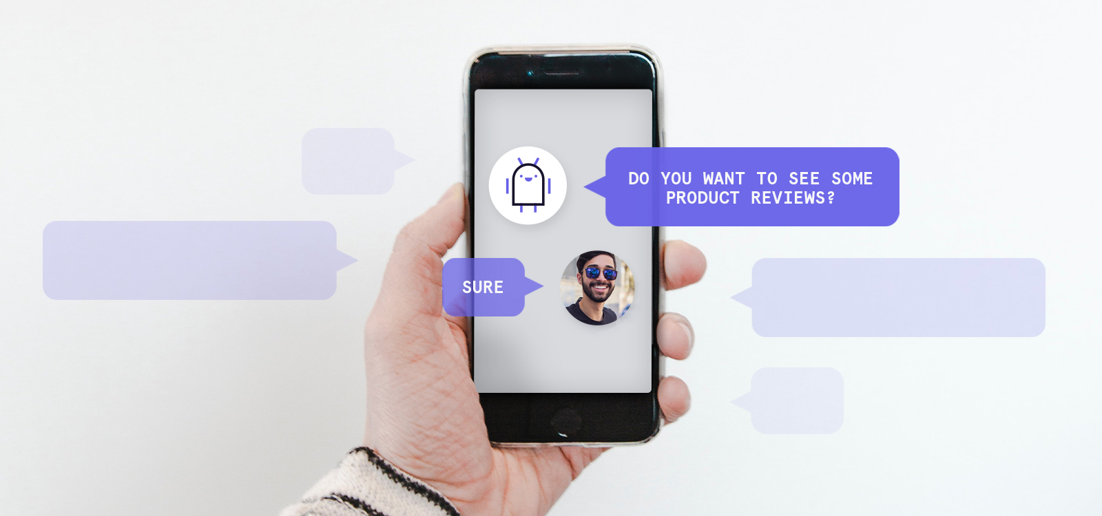 A hand holding a smartphone showing a chatbot conversation.