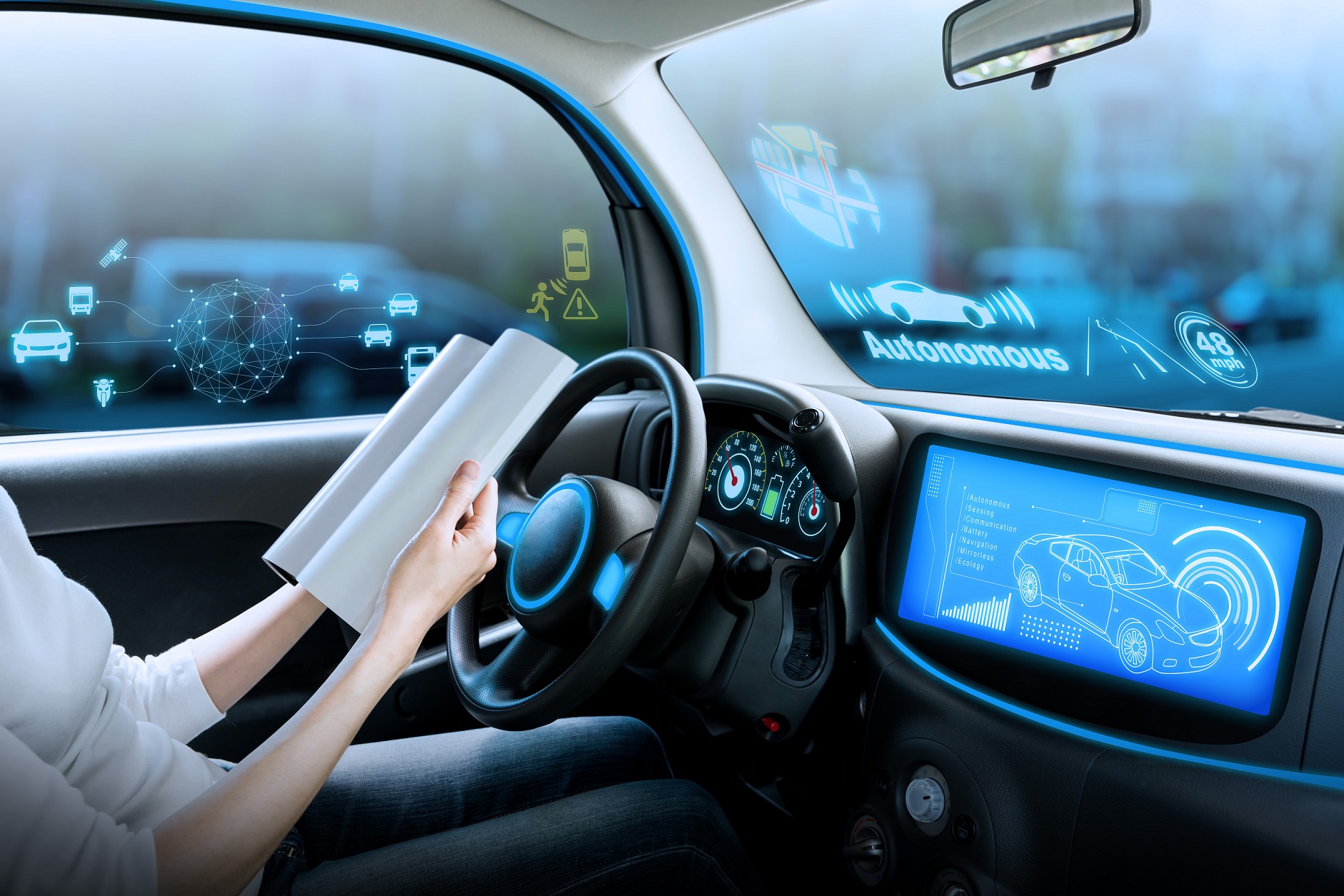 A person in a futuristic vehicle reviewing data on screens.