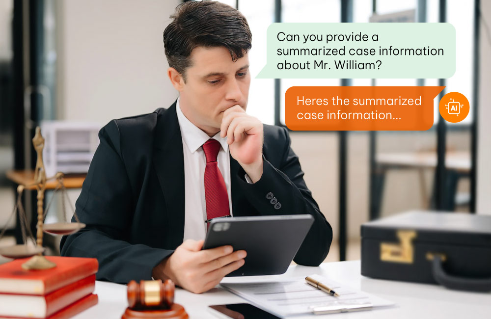 A man in a suit at a desk with a tablet discussing a client case.