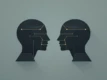 Abstract illustration of geometric shapes representing communication between AI agents.