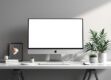 A sleek, minimalist desktop workspace featuring a modern computer monitor and stylish desk accessories.