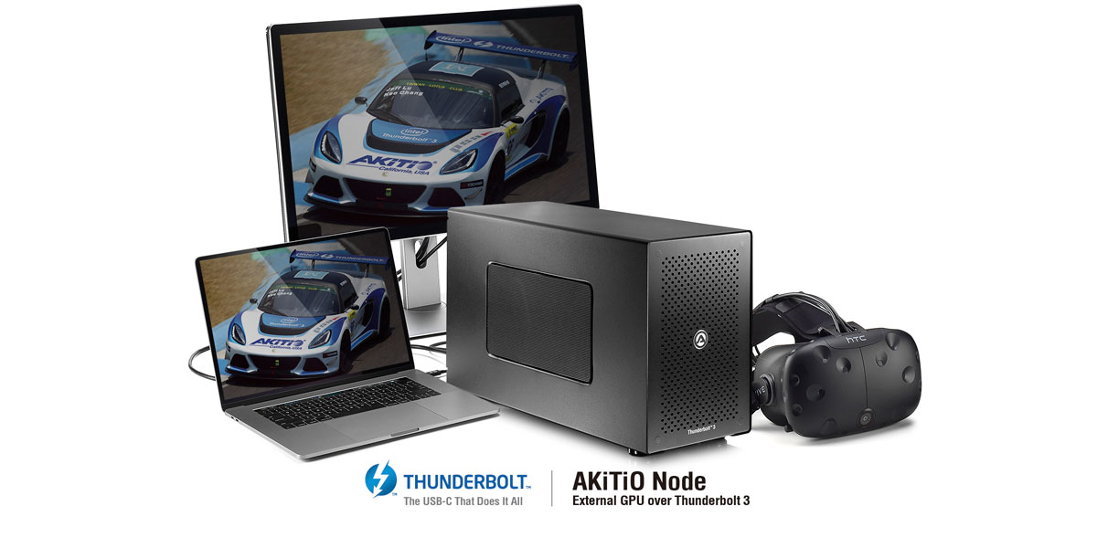 Laptop and monitor showing racing car graphic with GPU and VR headset.