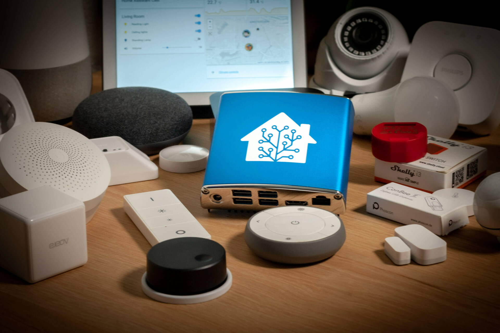 A display of various smart home devices on a wooden surface.