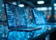 A sleek, modern workspace featuring a holographic display with interconnected nodes and flowing data streams in blue and white.