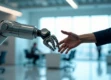 A sleek, modern robotic arm and human hand reaching towards each other in a bright office setting.